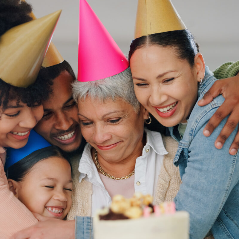 Family gathered in a historic hall raising glasses to celebrate an anniversary at Belle Vie.